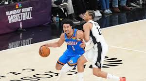 May 24, 2026; San Antonio, Texas, USA; Oklahoma City Thunder guard Jared McCain (3) drives the ball past San Antonio Spurs forward Carter Bryant (11) in the third quarter during game four of the western conference finals for the 2026 NBA playoffs at Frost Bank Center. Mandatory Credit: Daniel Dunn-Imagn Images | Daniel Dunn-Imagn Images